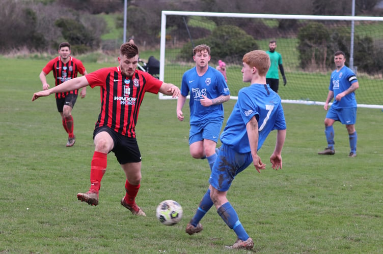 Malew’s Eddie Cooper and DHSOB’s Ty Thompson in action during Saturday’s ECAP FA Cup tie