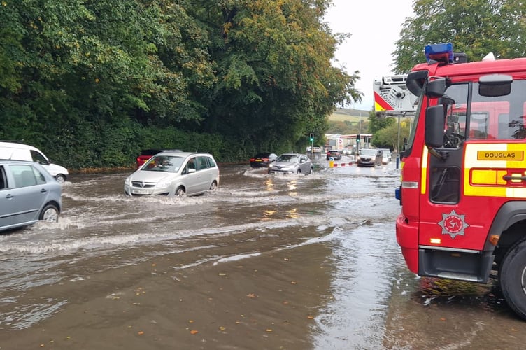 Fire engine assisting with scenes of flooding in Douglas and Onchan