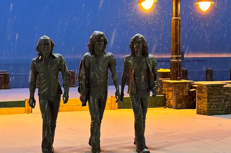 Bee Gees statue on Douglas Promenade in the snow