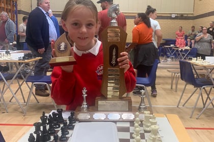 Rosa, 9, wins top chess trophy
