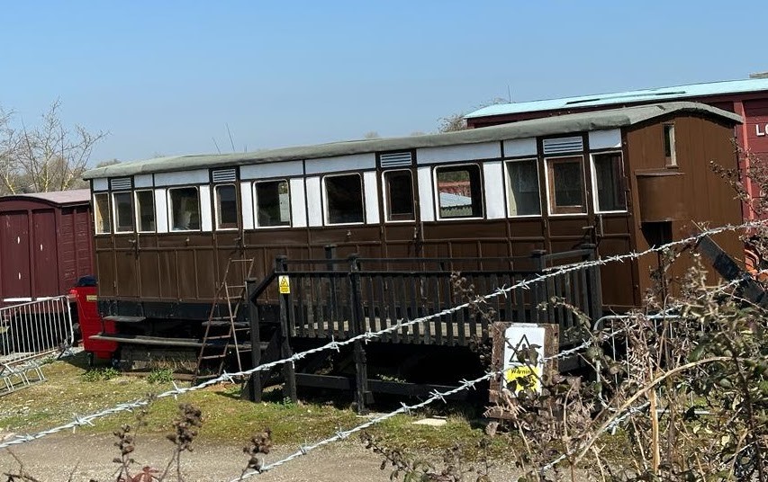 Old Trolley of Fishing Men on an Abandoned Narrow-gauge Railway in