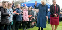 Queen Camilla tells crowds King Charles is 'on the mend'