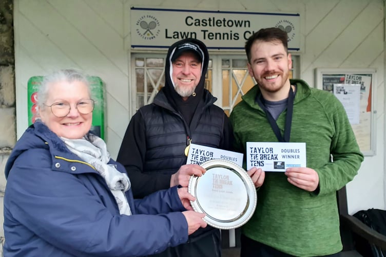 Debbie Taylor presents the Taylor Tie Break Tens doubles shield to Jos Woolford (centre) and Marc Chinn