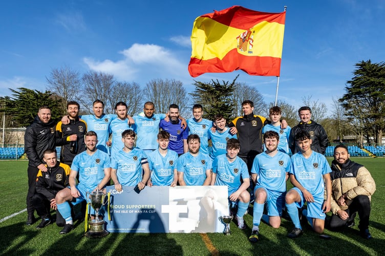 Rushen United players and coaches celebrate after winning the ECAP FA Cup thanks to victory over Ayre United at the Bowl on Easter Saturday (Photo: Gary Weightman)