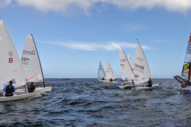 Peter Cope (far right) blasts over the start line with overall winner Simon Pressly just behind him during last weekend's Easter Regatta in Ramsey Bay