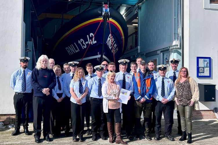 Jamie Barrow's mum, Valerie Nelson, presents Ramsey Lifeboat Station with £2,300