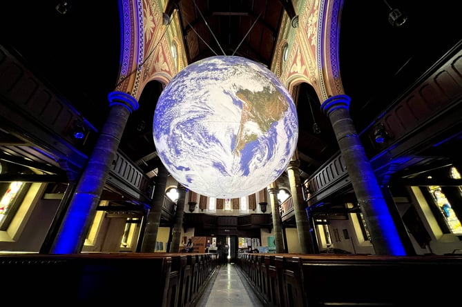 Gaia, an illuminated globe installation by UK artist Luke Jerram, at St Thomas' Church in Douglas