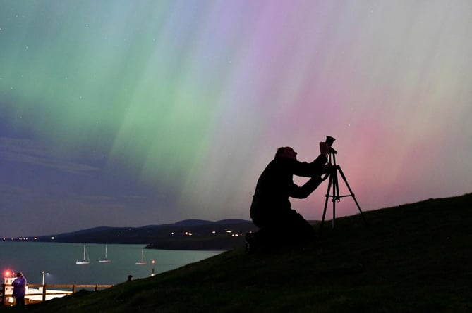 Adrian Darbyshire sets up his tripod on Peel Hill to get a glimpse of the Northern Lights