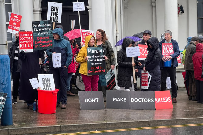 A number of those against the assisted dying bill outside Tynwald on Tuesday 