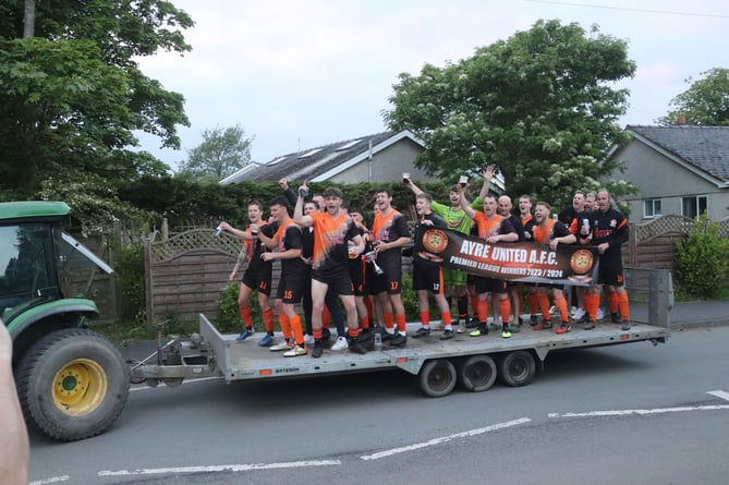 After sealing the Premier League title, Ayre Utd players paraded through the streets of Andreas village on the back of a flatbed, similar to Foxdale last week when winning Division Two! 