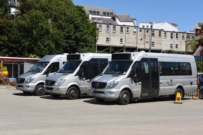 Bus Vannin minibuses parked by the railway station
