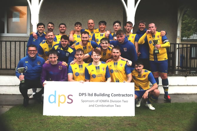 Onchan players and coaches celebrate with the DPS Ltd Combination Two trophy after receiving the silverware on Wednesday evening (Photo: Paul Hatton)