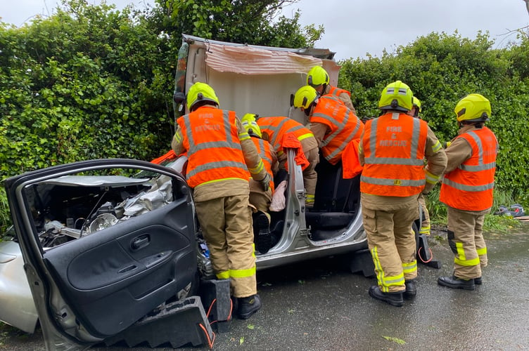 Fire crews had to cut someone from a car in Ballasalla earlier today