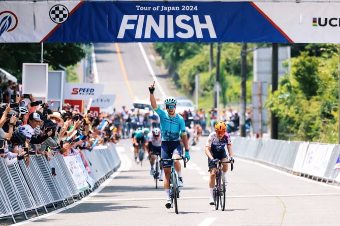 Max Walker celebrates as he crosses the finish line to win the seventh and penultimate stage of the Tour of Japan on Saturday (Photo: Tour of Japan)