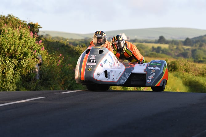 The incident happened after the red flag was raised when sidecar competitors Chris Schofield and Tom Dawkins pictured) crashed