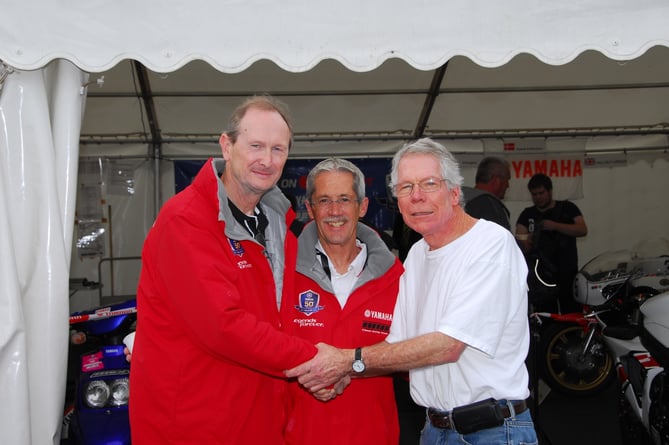Allan Brew (left) eldest son of the late Dennis Brew who initially invited Pan Hennen (right) to the island in 1977. Pictured with them is Steve Baker during a visit to the Classic TT in 2013. Former rider Brew is chairman of the Manx Grand Prix Supporters Club 