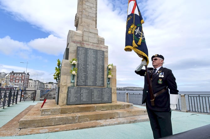 A service to mark the centenary of the Douglas War Memorial on Harris Promenade - standard bearer David Quirk, chair of the Isle of Man branch of the Royal Navy Association