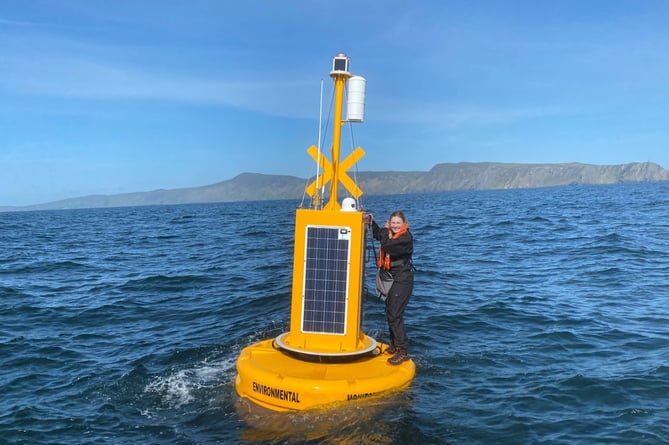 DEFA’s marine monitoring officer Taylor Bridgens on the monitoring buoy off the coast of Port Erin