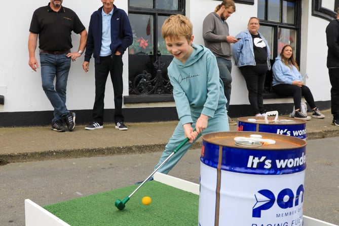George, Aged 6 playing TT-themed mini golf at Peel TT Day
