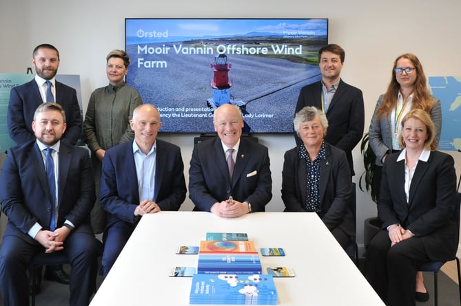 Lieutenant Governor Sir John Lorimer and Lady Lorimer pictured with Duncan Clark (seated, second from left) and John Galloway (seated, far left) of Ørsted and members of the Mooir Vannin Offshore Wind Farm development team