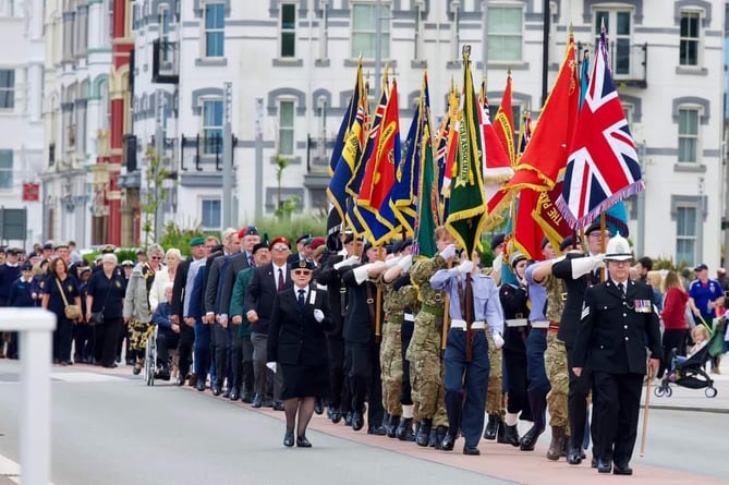 Serving military personnel joined reservists, cadets and veterans in parading along Douglas Promenade