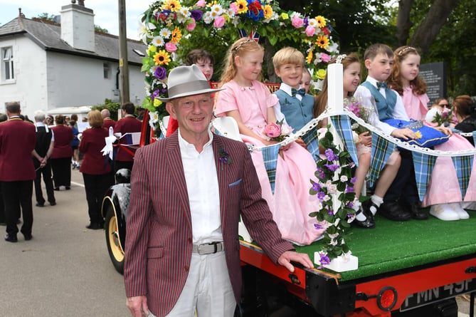 Driver Kevin Skinner accompanies the Arbory School children  during the opening parade