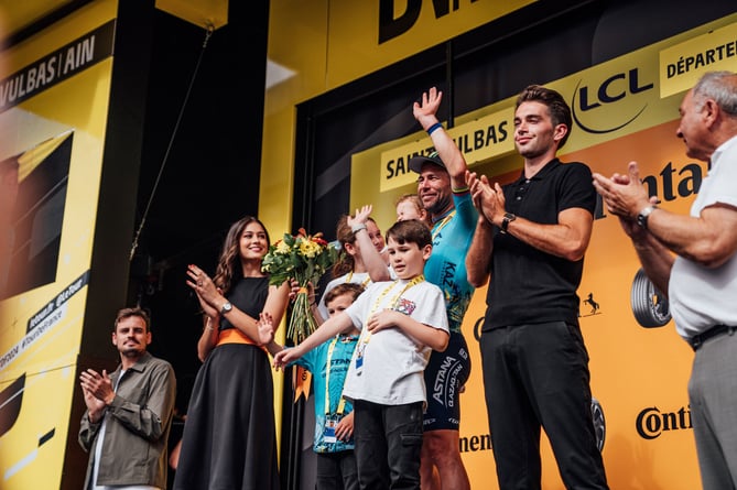 Mark Cavendish celebrates on the podium with his children after his record-breaking 35th stage victory at the Tour de France on Wednesday afternoon. The Manx Missile now holds the outright record of wins at Le Tour ahead of the legendary Eddy Merckx (Photo: Zac Williams/SWpix.com)