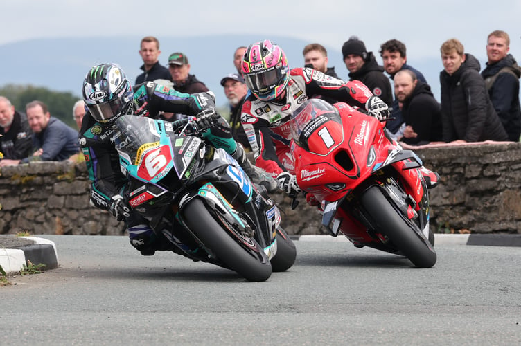 Michael Dunlop leads Davey Todd round Castletown Corner  during the Isle of Man Steam Packet-sponsored Senior race on Thursday morning (Photo: Peter Callister)