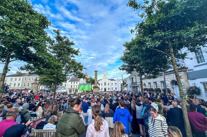 Crowds gather to watch the European Championship final between Spain and England in Castletown Market Square