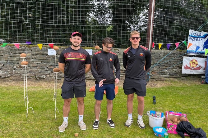 Marown AFC members Jon Kenyon, Rhys Westwell and Ricky Prizevs ran the coconut shy stall