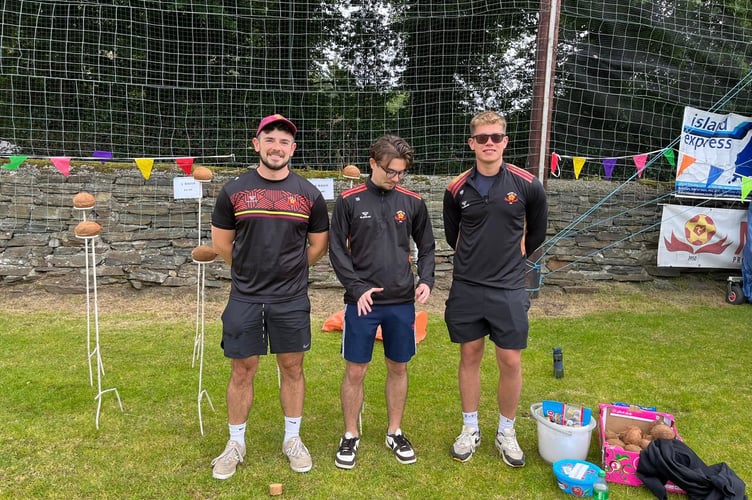 Marown AFC members Jon Kenyon, Rhys Westwell and Ricky Prizevs ran the coconut shy stall