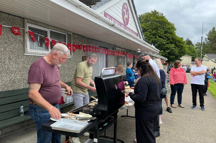 Juan Brain and Dave Brew served the crowds with BBQ food