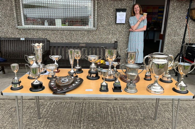 The prestigious trophies on offer, pictured with helper Tracy Willoughby