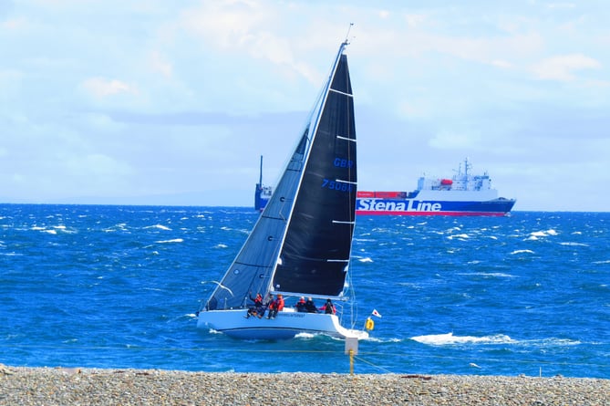 A Crewed Interest - seen here at the Point of Ayre with a Stena Line ship in the background - was the leading local crew in the recent Round the Island Race when finishing second