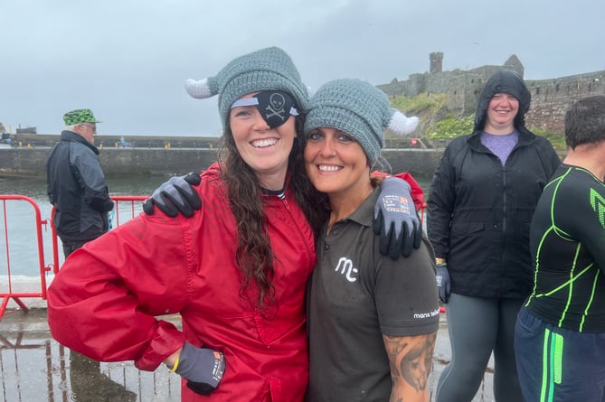 Katie Christian and Emma Cain were in high spirits despite the wet weather