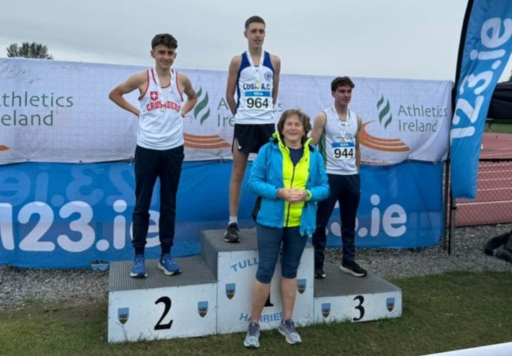 Cai Lewis (left) receiving his silver medal from grandmother Mary Purcell