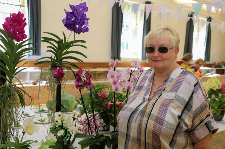 Pam Gold with her Orchid that received best in pot plant section