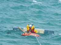 Rescue teams save two from raft stranded in the sea off Isle of Man