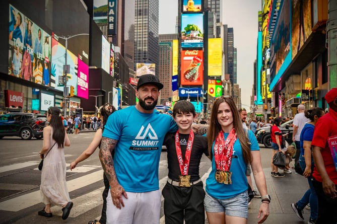 (Left to right) Summit Grappling head coach Conrad Roberts, Alan Greenhalgh and Hayley Curtis in Times Square after the IBJJF New York Jiu-Jitsu Open 