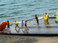 Rescue teams save two from raft stranded in the sea off Isle of Man