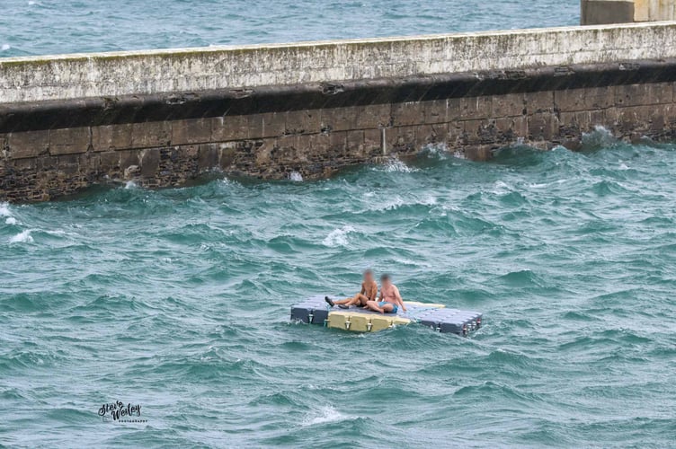 The two individuals stuck on the raft in Ramsey Bay