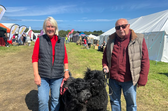 Yvonne and Glen Murphy with their Black Russian Terrier's Sasha and Ada