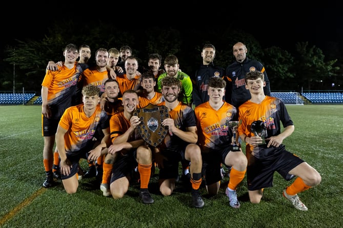 Ayre United celebrate winning the Eric Fletcher Charity Shield after beating Rushen United 2-1 in Friday evening's clash at the Bowl (Photo: Gary Weightman)