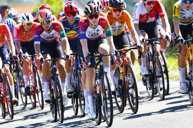 Lizzie Holden (centre) in action for UAE Team ADQ during the opening stage of the Tour de France Femmes (Photo: Rafa Gomez/SprintCyclingAgency)