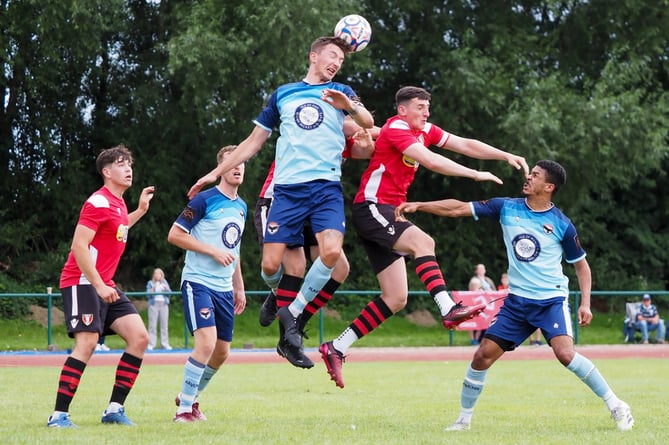 FC Isle of Man captain Sean Doyle towers above a Litherland REMCYA opponent to win a header during Saturday's match in Merseyside (Photo: Nick Gerrard Photography)