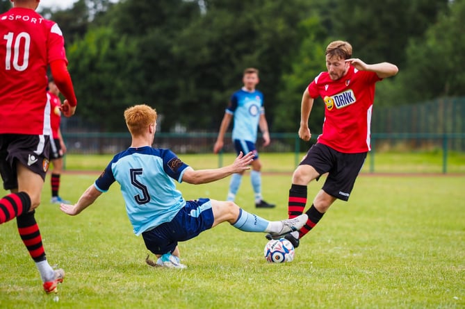 FC Isle of Man defender Callum Sherry challengers a Litherland opponent (Photo: Nick Gerrard Photography)