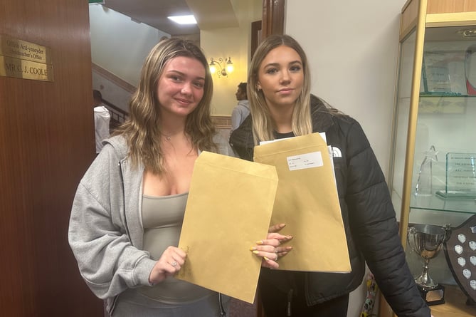 Hollie Cairney and Lily Mulchrone pictured together receiving their results.