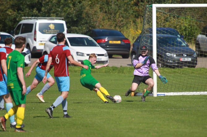 St Mary's striker Owen Canipa fires goalwards during his side's Canada Life Premier League clash with Union Mills on Saturday afternoon. Mills goalkeeper Mason Prince denied him and his team-mates to help the Garey Mooar side claim a 3-0 win on the opening day of the season and claim a place in Team of the Week (Photo: Dave Norton)