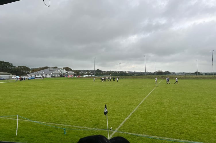 Castletown players walk into the changing rooms at Station Fields