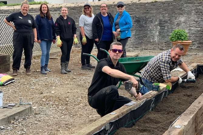 PlayItForward scheme and Manx Wildlife Trust volunteers working at the site of the new community garden at Government House